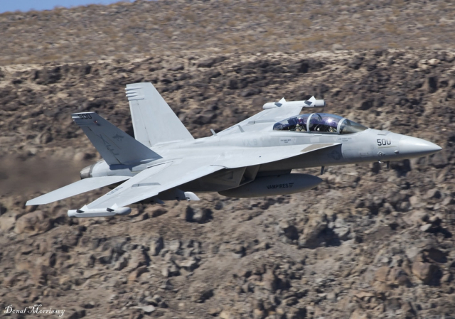 A U.S. Navy EA-18G Growler, assigned to VAQ-135 “Black Ravens,” crashed into San Diego Bay on February 7, 2025, shortly after takeoff from Naval Air Station North Island. The aircraft, identified as Boeing EA-18G Growler 166855, was participating in military exercises when it lost altitude and entered a steep descent. Both crew members ejected safely and were rescued by a fishing boat. Surveillance footage captured the aircraft nosediving into the water near Shelter Island Drive. Emergency teams, including the U.S. Coast Guard and Navy personnel, responded swiftly, securing the crash site near Kellogg Beach. Investigators are reviewing weather conditions, mechanical failure, and pilot disorientation as possible causes. Salvage operations and environmental containment efforts are ongoing as officials continue to assess the incident.